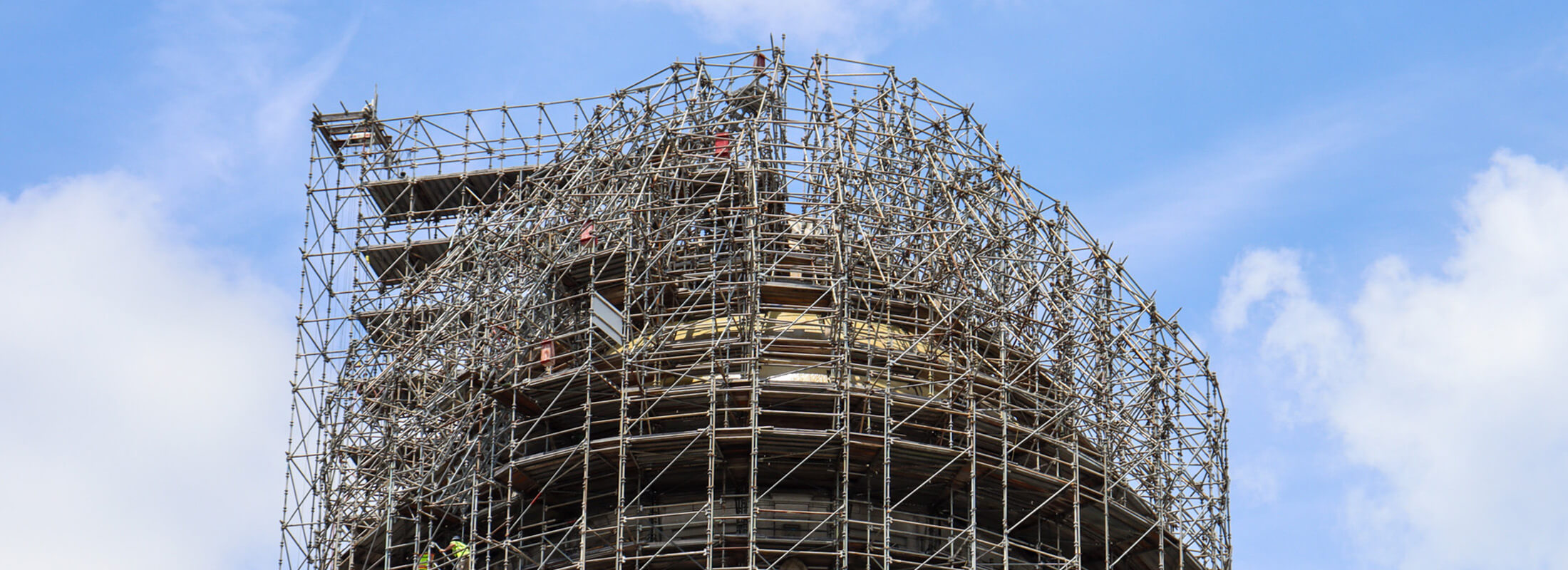 Close up of the Kentucky Capitol building's tower with scaffolding around it.