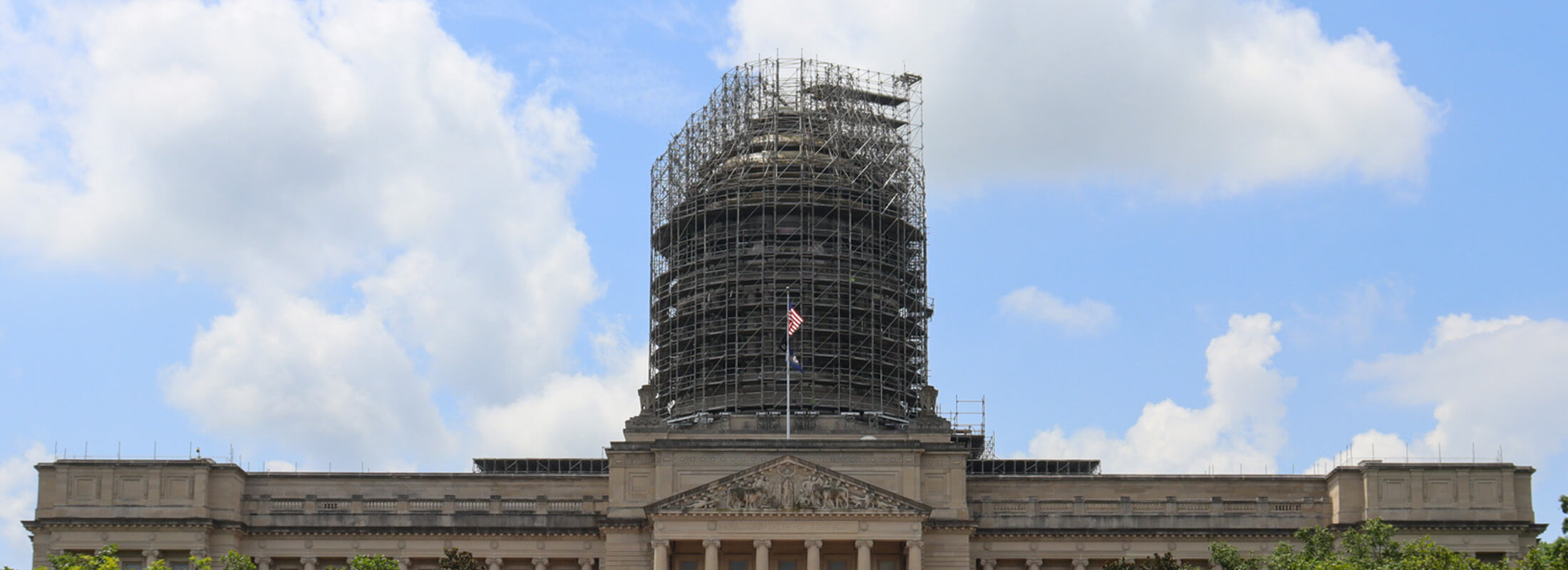 Wide view of the Kentucky Capitol building with scaffolding around the tower.